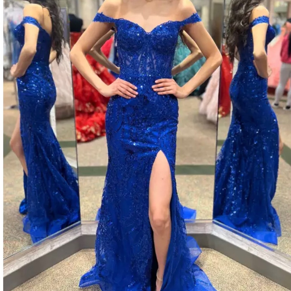 Size 2 Sherri Hill Prom Dress. New with Tags. Never worn. Stunning vibrant color